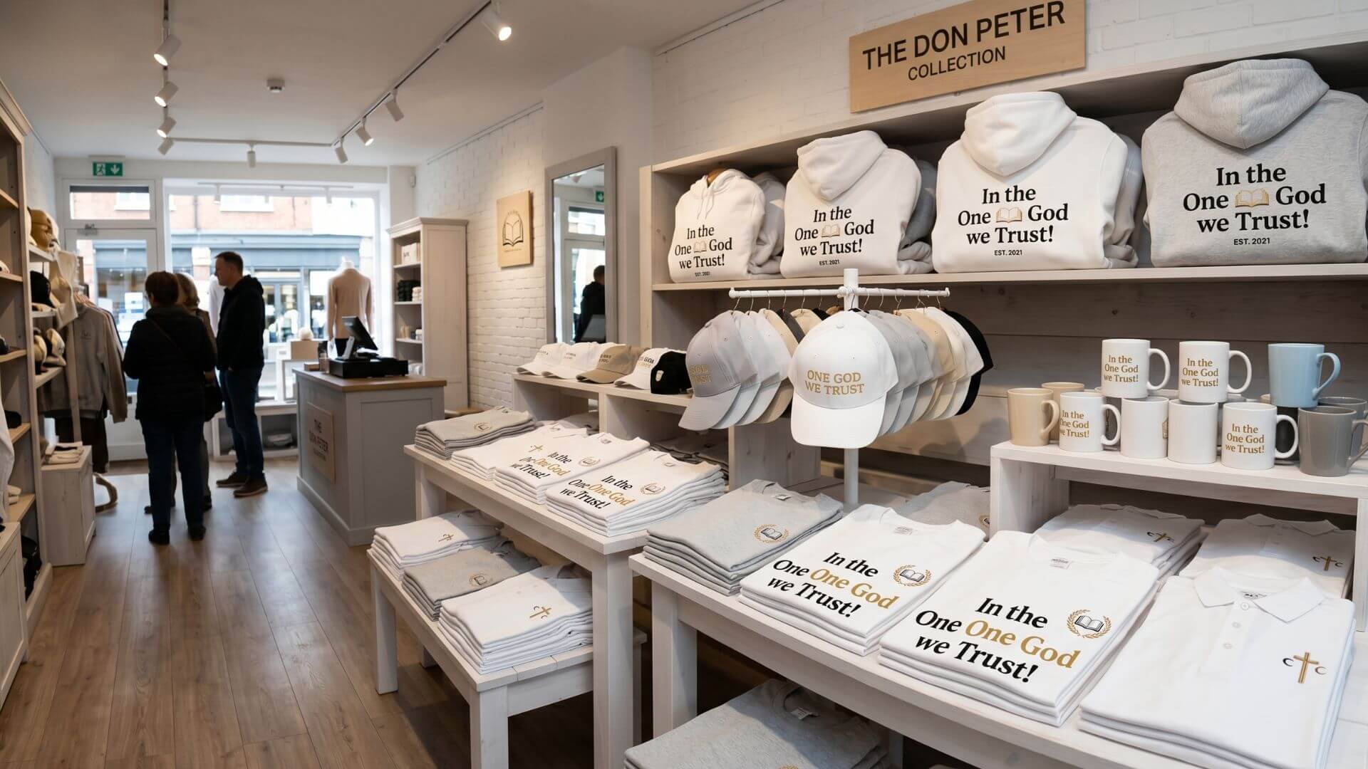 Don Peter's Collection flagship store display featuring "In the One God we Trust!" apparel, caps, and mugs.