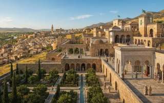 Digital historical artwork depicting a reconstructed view of Medina Azahara, the 10th-century Caliphate palace city near Córdoba, Spain. Features multi-level stone terraces, courtyard gardens, horseshoe arches, and surrounding hills.