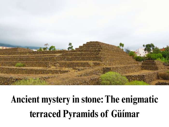 Authentic photo of the dry-stacked volcanic stone step pyramids at Güímar, featured in a Tenerife historical travel guide.