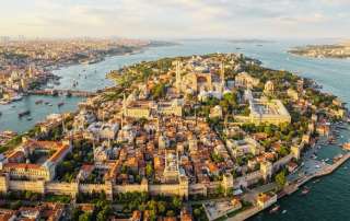 Aerial view of medieval Constantinople featuring the historic peninsula, ancient walls, and the Hagia Sophia during the Byzantine era.